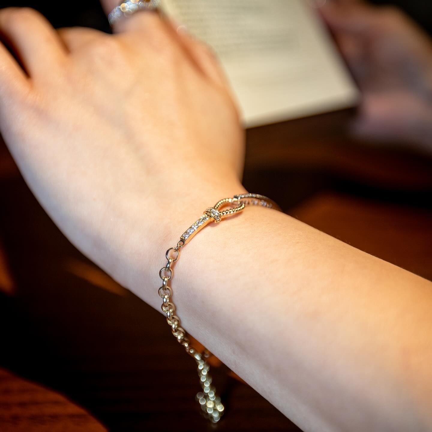 Delicate gold and diamond bracelet on a wrist